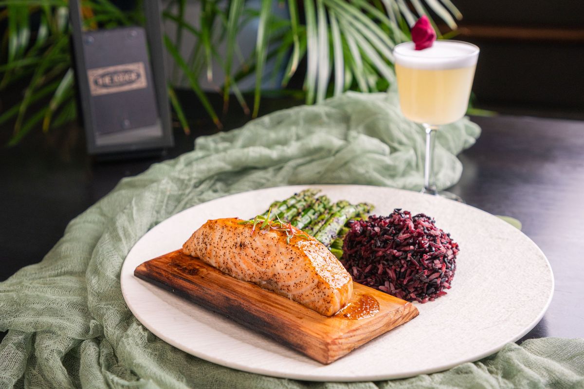 Cedar Plank Salmon with a cocktail at The Lodge
